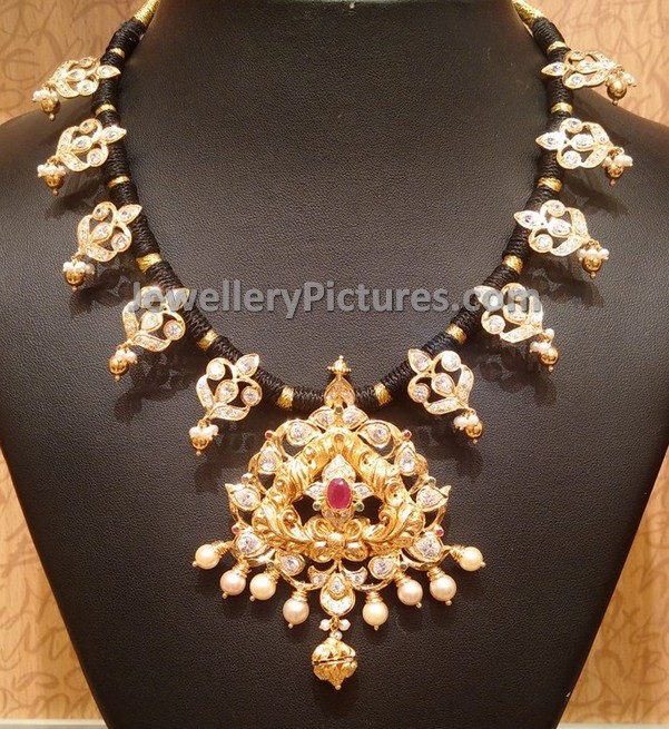 Traditional necklace with black silk threads and uncuts
